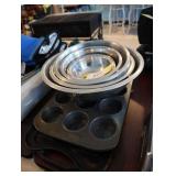 Lot of mixing bowls, muffin pans, griddle