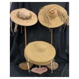 STRAW HATS AND HAT STANDS