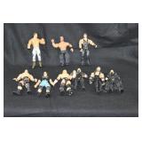 LOT OF NINE LARGE WWE ACTION FIGURES AND THREE SM