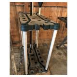 Hand tool rack with rake and a hoe