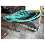 Wheel barrel and garden hose