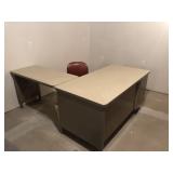 L shaped metal office desk with pad and chair