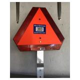 Plastic slow moving vehicle sign