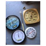 Thermometers and rain gauge
