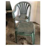 Green plastic chair and end table