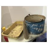 Enamel pots and soda bottles