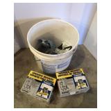 Sawhorse brackets and bucket contents