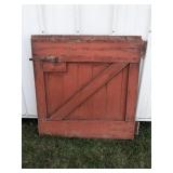 Red barn door with spring latch