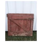 Red barn door with spring latch