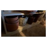 Flower pots on bottom shelf