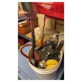 Gardening tools in bucket