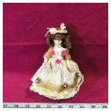 Sabre Fine Porcelain Doll & Stand (6 1/4' Tall) Sabre Fine Porcelain Doll & Stand (6 1/4' Tall)