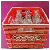 Milk Crate With 9 Antique Milk Bottles