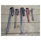 (4) Pipe Wrenches and (1) Adjustable Wrench