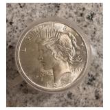 Roll of uncirculated silver dollars