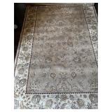 Cream and tan rug. 5ï¿½ x 8ï¿½.
