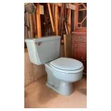 Blue American standard toilet vanity, sink, and