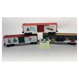 Three Lionel train cars