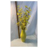 Yellow vase with flowers
