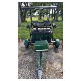 Two wheeled pull behind cart seats two people