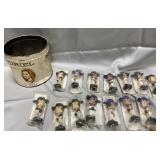 14 baseball figurines and a Muriel cigar tin, no