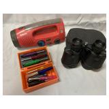 Flashlight/radio, binoculars and tools in tiny