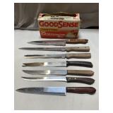 Stainless steel kitchen knives and a box of trash