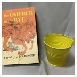 1979 "The Catcher in the Rye" book & small bucket