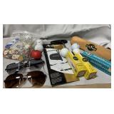 Sunglasses, golf balls, tees and lightbulbs