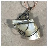 Vintage carved mother of pearl horse pendant