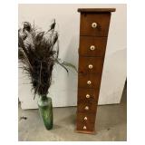 Vase of peacock feathers and 41" tall wood piece