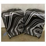 Two American tourist suitcases both on rollers,