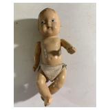 Antique 8" composite doll. No markings.
