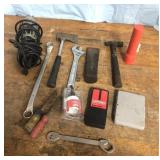 Tools, hatchet, loght and kore.