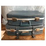 Matching pair of hard shell suitcase is vintage
