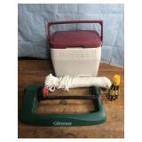 Small Coleman cooler rope and a lawn sprinkler