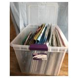 Tote with lid filled with Christmas bags and