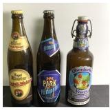 Three empty German beer bottles.