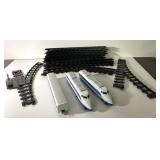 Train tracks and 3 battery operated train pieces