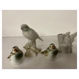 3 bird figurines, and a bird themed toothpick