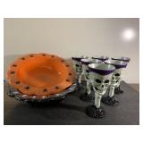 Six 7" skull plastic cups and 2 candy bowls
