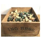 Wood Sewing Spools in vintage crate