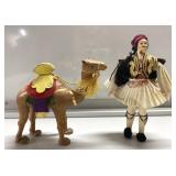 Vintage man with camel dolls