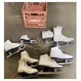 Milk crate full of vintage ice skates
