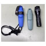 2 knives in sheaths & flashlight