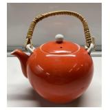 Vintage teapot with wicker handle Vintage teapot with wicker handle