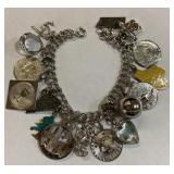 Charm Bracelet with a lot of Silver/Sterling Charm Bracelet with a lot of Silver/Sterling