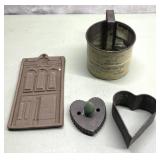Antique cookie cutters, advertising sifter & more
