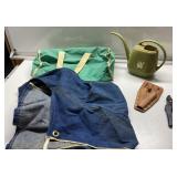 Apron, clippers, watering can and small duffel