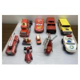Toy cars, trucks, helicopters, firetruck